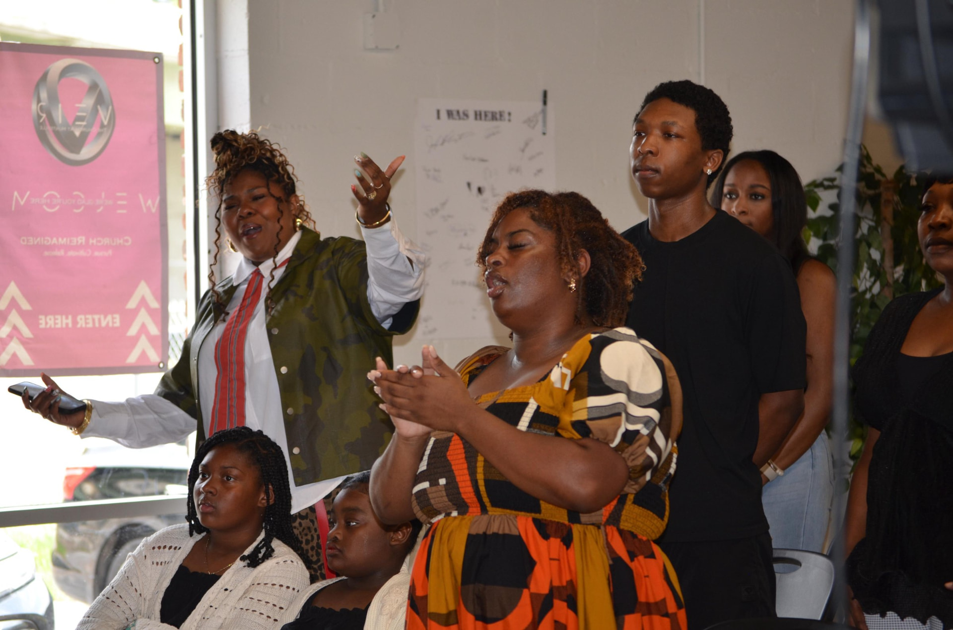 A family singing together in worship